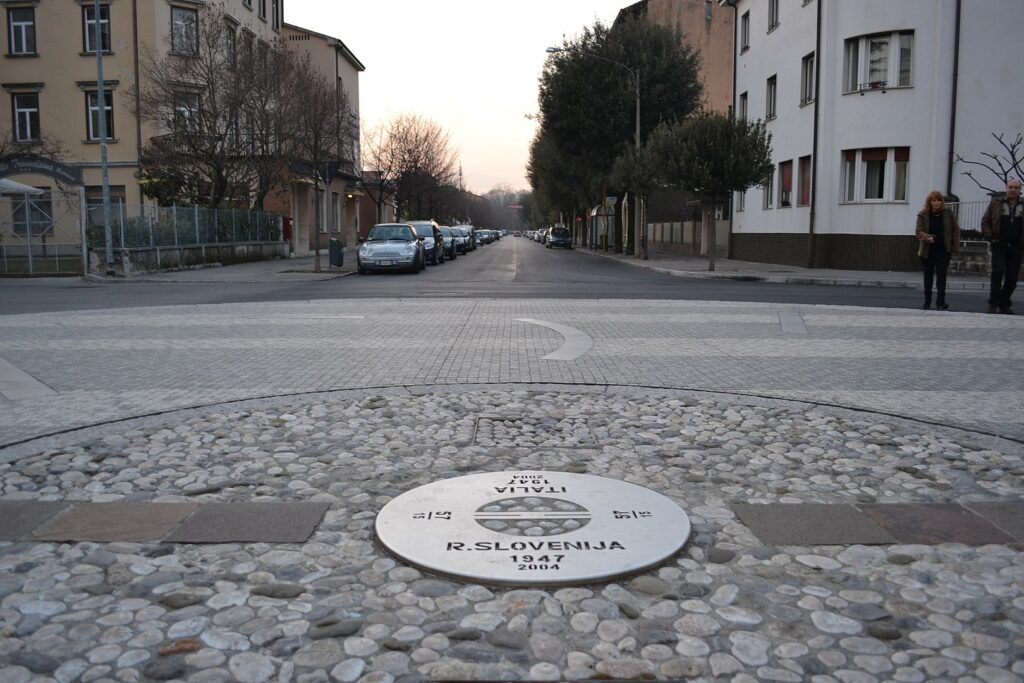 Transalpine Square - A simple plaque now marks the border between the two States